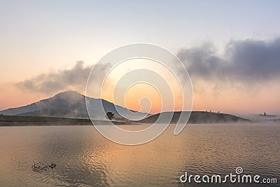 Suoi Vang lake with Langbiang mountains in the morning Stock Photo