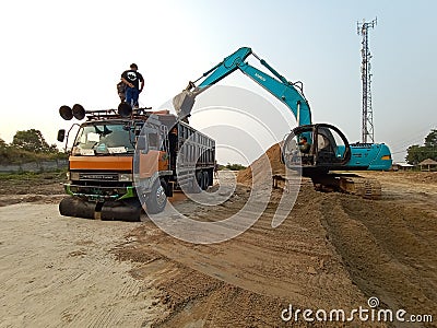 Super Big Truck vs Excavator Editorial Stock Photo