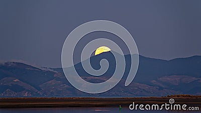 A super blue moon rises over Nelson in New Zealand taken from Motueka Stock Photo