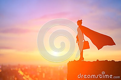Super business woman on mountain Stock Photo