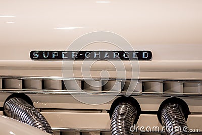 Super-charged. Retro engine mock-up with art deco super charged Stock Photo