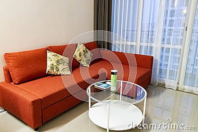 Super clean luxury apartment with red couch Bangkok Thailand Editorial Stock Photo