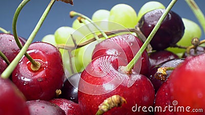 Super close up. Details of cherries, green and red grapes in a basket Stock Photo