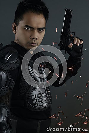 Super cops - asian man posing with a gun Stock Photo