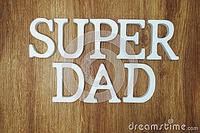 Super Dad Word alphabet letters on wooden background Stock Photo