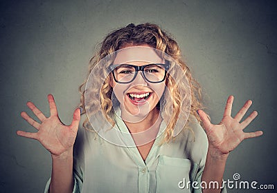 Super excited funky looking girl in glasses screaming Stock Photo