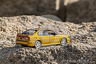 Super fast car on the mountain seen from its back. Stock Photo