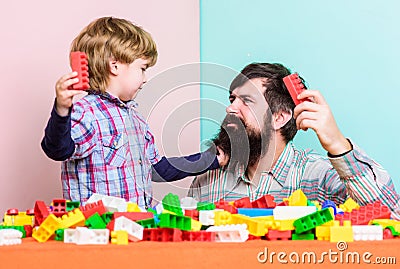 Super father. building home with colorful constructor. happy family leisure. child development. small boy with dad Stock Photo