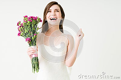 Super happy bride celebrating after marrying Stock Photo