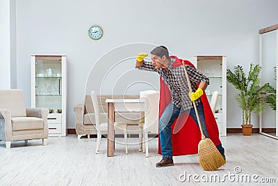 The super hero cleaner working at home Stock Photo