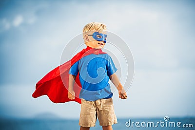 Super Hero kid with a mask flying Stock Photo