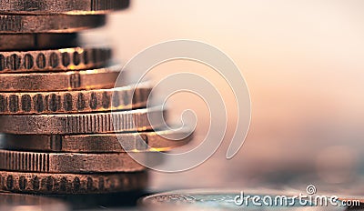 Super macro stack of coins on the table, side view, selective focus Stock Photo