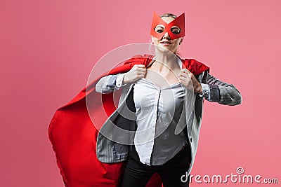 Super Manager, funny superhero. Female power, the girl in the mask of the hero and the red cloak, Stock Photo