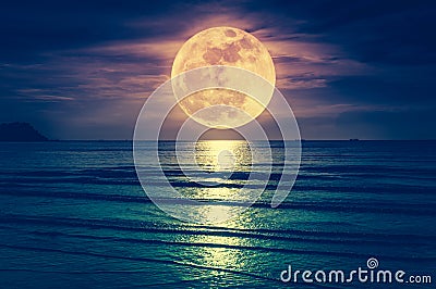 Super moon. Colorful sky with cloud and bright full moon over se Stock Photo