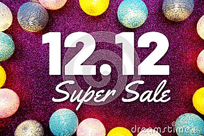 12.12 Super Sale text and LED cotton Balls Decoration on pink Glitter background Stock Photo