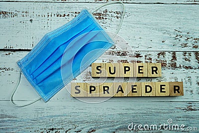 Super Spreader word letter on wooden background Stock Photo