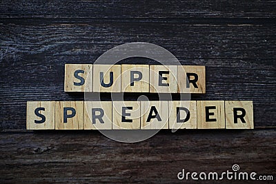 Super Spreader word letter on wooden background Stock Photo