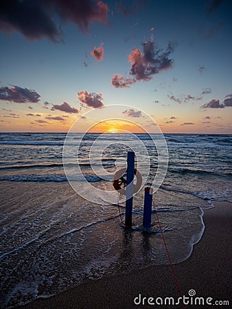 Super sunset in the south of sardinia in front of the stack of sugar loaf Stock Photo