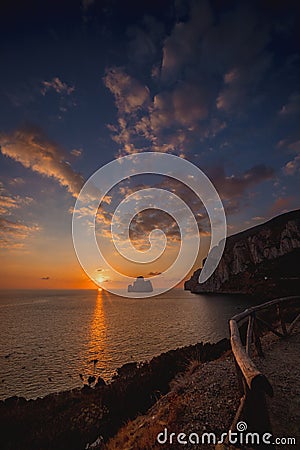 Super sunset in the south of sardinia in front of the stack of sugar loaf Stock Photo