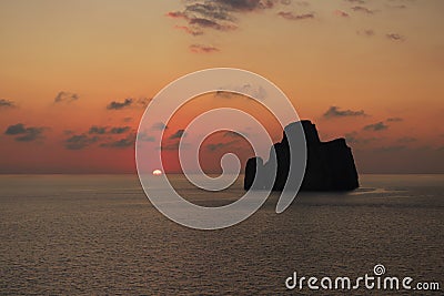 Super sunset in the south of sardinia in front of the stack of sugar loaf Stock Photo