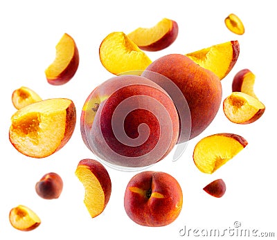Superbly retouched whole peaches and slices fly and levitate in space. Selective focus. Isolated on white Stock Photo
