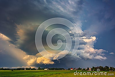 Supercell storm clouds with wall cloud and intense rain Stock Photo