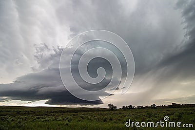 A supercell thunderstorm updraft spirals high into the sky of eastern Colorado in this eerie scene. Stock Photo