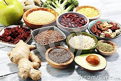 Superfood concept on white table with avocado, goji and nuts and Stock Photo