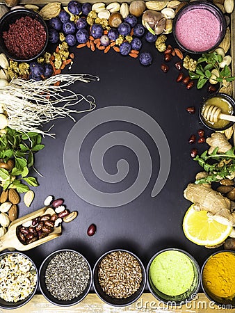 Superfoods on dark wooden table with space for text Stock Photo