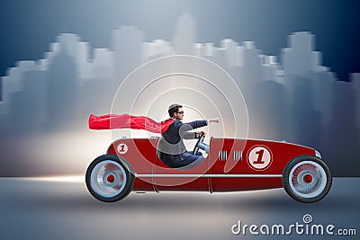 The superhero businessman driving vintage roadster Stock Photo