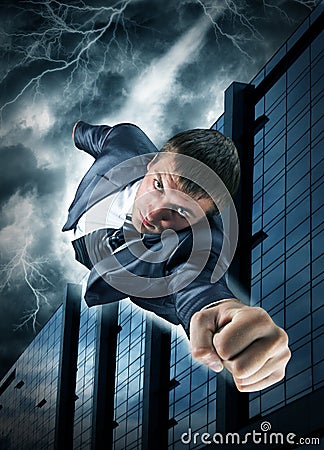 Superhero businessman flying over downtown Stock Photo