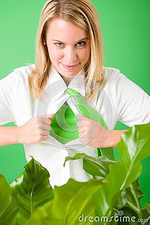 Superhero Businesswoman confident face green plant Stock Photo