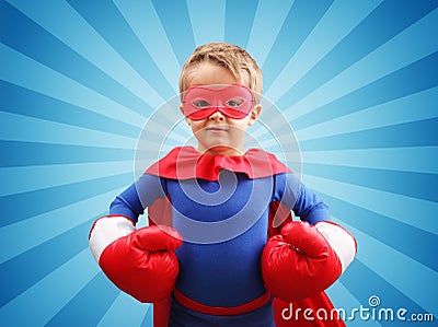Superhero child with boxing gloves Stock Photo
