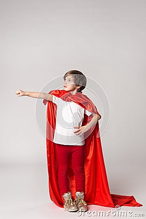 Superhero child pretend what she flying in sky Stock Photo