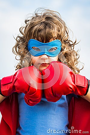 Superhero kid. Girl power concept Stock Photo