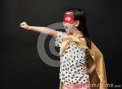 Superhero kids on a black background Stock Photo