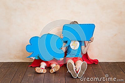 Superheroes children holding speech bubbles blank Stock Photo