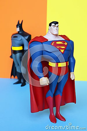 Superman and Batman on pastel colors background. Editorial Stock Photo