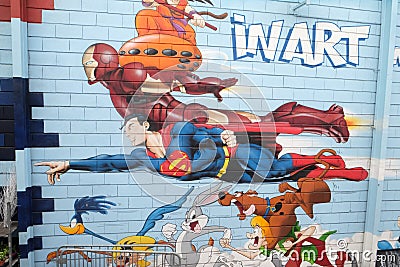 Superman, graffiti wall mural comic book, flea market, St. Ouen Clignancourt in Paris Editorial Stock Photo