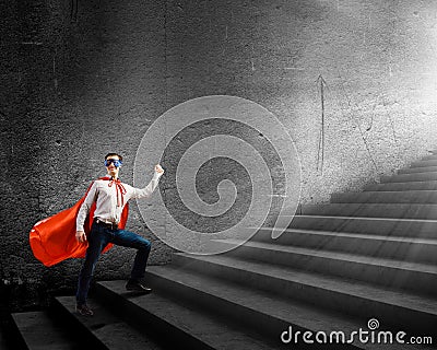 Superman on ladder Stock Photo