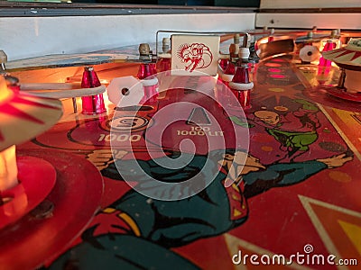 Superman pinball machine playfield detail of spinner Editorial Stock Photo