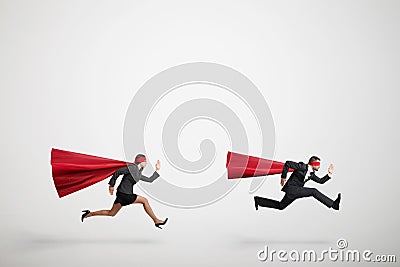 Superman and superwoman fast running Stock Photo