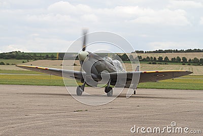 Supermarine Spitfire 2 seater front three quarter view - taxing on runway at Duxford aerodrome Editorial Stock Photo