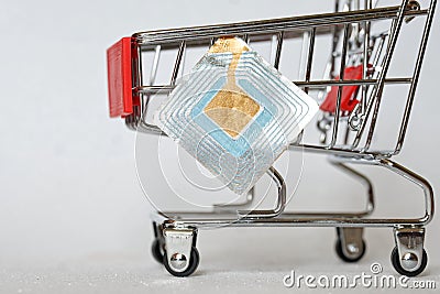 Supermarket trolley and RFID tag. Shoplifting Prevention. Goods security and alarm. Free space for an inscription. Light Stock Photo