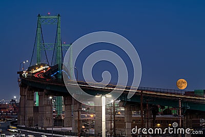 Supermoon Rise over Vincent Thomas Bridge in San Pedro, Ca Stock Photo