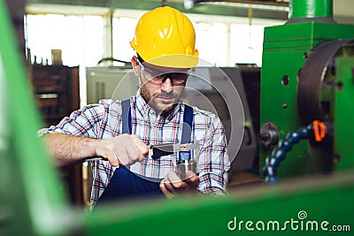 Supervisor doing quality control and production check in factory Stock Photo