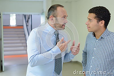 Supervisor giving speech to intern Stock Photo