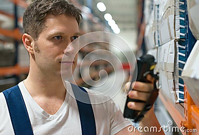 Supervisor scanning package barcode. Stock Photo