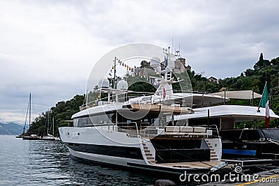 Superyachts moored in Portofino harbour, Italy Editorial Stock Photo