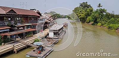 Buildings and rafts on Tachin riverside at Sam chug district, Suphan Buri in year 2018 Editorial Stock Photo